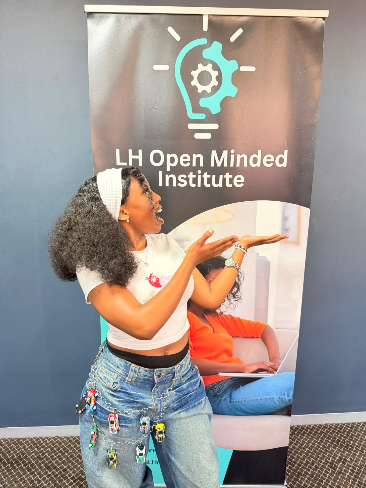 Student with institute banner