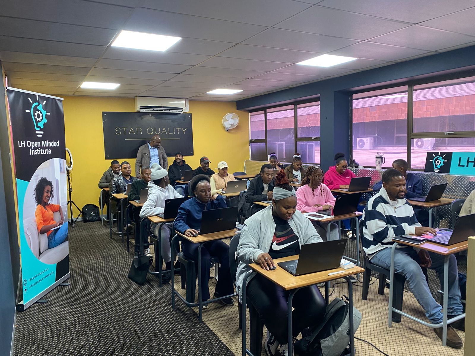 Classroom full of students with laptops